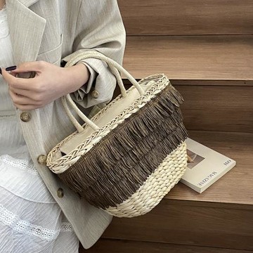 海邊度假沙灘包包女2025新款夏季編織草編包時尚流蘇手提菜籃子包
