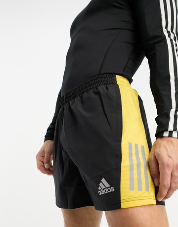 adidas Running Own The Run 5 inch shorts in black and yellow