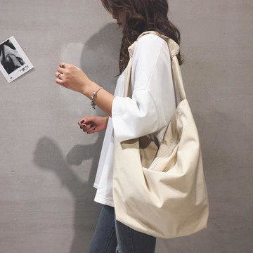 大容量簡約帆布包包女2026新款日系原宿單肩餃子包百搭學生斜挎包