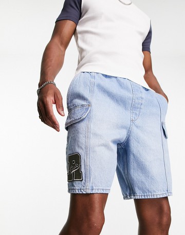 ASOS DESIGN pull on regular length denim cargo shorts with patch in mid wash blue