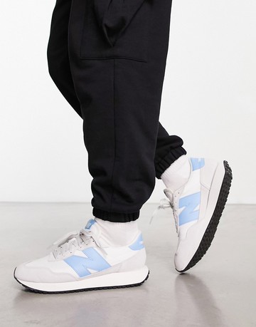 New Balance 237 trainers in off white and blue