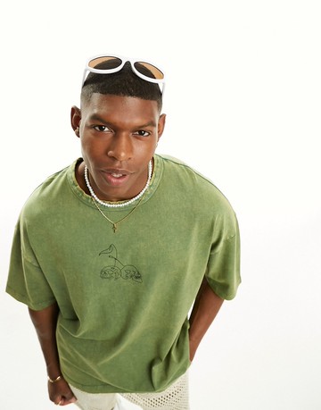 ASOS DESIGN oversized heavyweight t-shirt in washed green with skull chest print