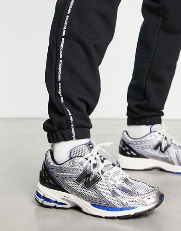 New Balance 1906 trainers in white metallic and blue with black