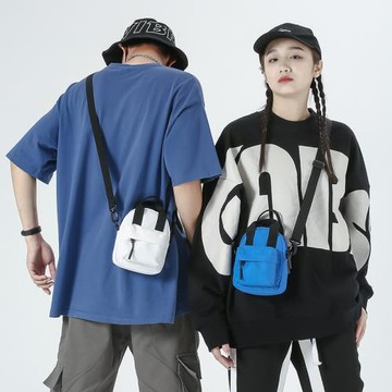 新款時尚韓版單肩斜挎包男女士長款錢包可愛胸包純色手機小包批發