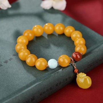 琥珀蜜蠟圓珠單圈手串搭配時尚風錢袋配飾南紅綠松石雅致女款手飾