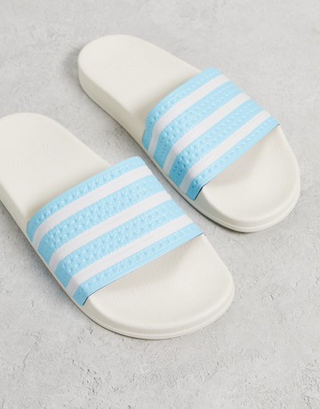 adidas Originals Adilette sliders in off white blue
