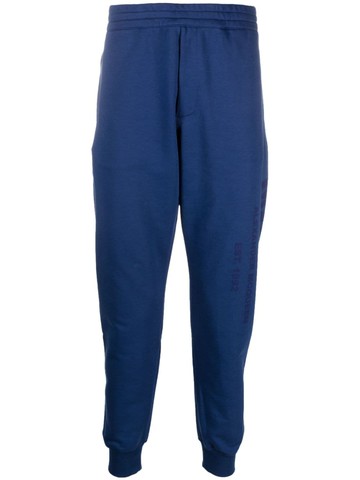 Alexander McQueen - logo-print track pants - men - Cotton/Cotton - S - Blue
