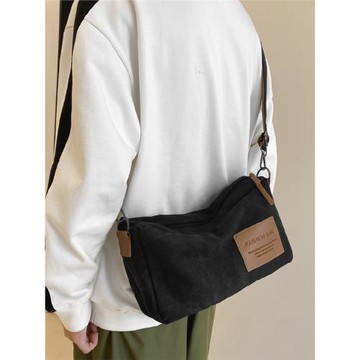 香港男士帆布包日系潮牌斜挎包男款休閑郵差包新款潮流背包單肩包