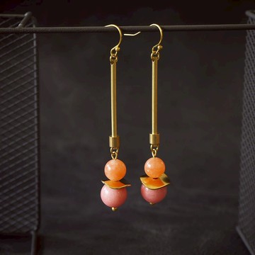 Coral tone pendulum style earrings