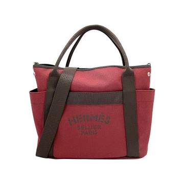 Hermes 展示品 The Grooming Bag 二用帆布購物袋(胭脂紅/巧克力)