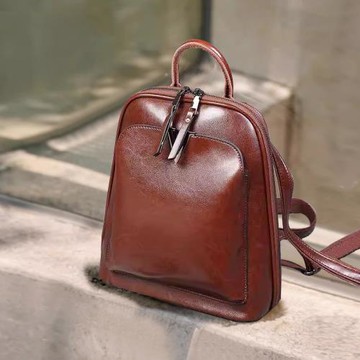 真皮雙肩包女2025新款女士通勤英倫學院風書包學生復古電腦包背包