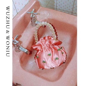 小眾設計法式復古手工串珠水晶包新款少女水桶包珍珠手拎提女包潮