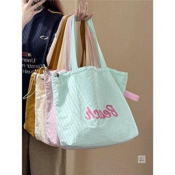 韓系ins慵懶字母印花尼龍抽繩單肩包日常百搭休閑學生通勤托特包