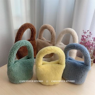 可愛顆粒絨羊羔毛毛手提包女秋冬新款簡約菜籃子圓筒手拿包潮