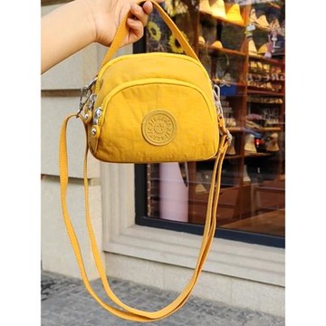 新加坡時尚帆布包女斜挎輕便百搭2026新款潮牛津布休閑單肩小圓包