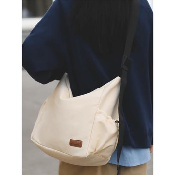 大容量帆布斜挎包女輕便收納旅行背包男休閑百搭單肩學生郵差包潮