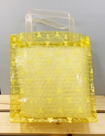 【震撼精品百貨】Hello Kitty_凱蒂貓~日本防水收納包/透明手提包-黃熊#87002