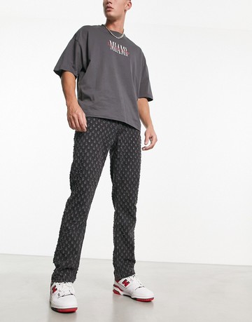 ASOS DESIGN straight leg jeans with distressed affect in washed black
