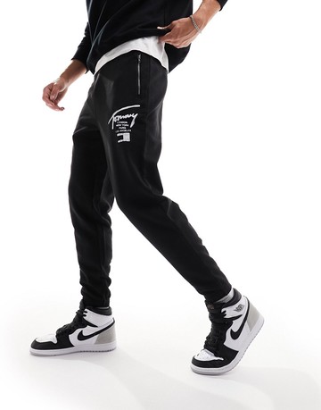 Tommy Jeans regular zip spray joggers in black