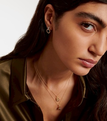 Stone and Strand Horsebit 14kt gold earrings with diamonds