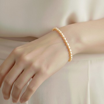 蜜桃粉橘 米粒淡水珍珠 14Kgf 包金 可調整手鍊 | 可改為純銀