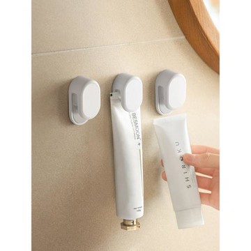 牙膏置物架免打孔壁掛式洗面奶擠壓器浴室衛生間墻上護手霜收納夾