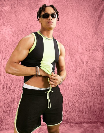 ASOS DESIGN skinny cropped vest in black and bright green colour block