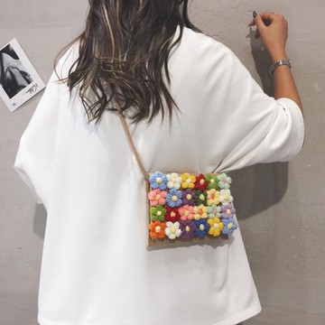 可愛花朵編織包包女2025新款夏小眾海邊沙灘草編包休閑手機斜挎包