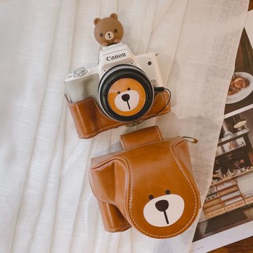 適用于索尼A6000佳能M50富士XA7棕色相機包zv1皮套黑卡通用呆呆熊