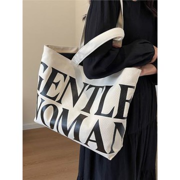 泰國小眾字母帆布包女大容量2025新款手提袋通勤包百搭單肩托特包