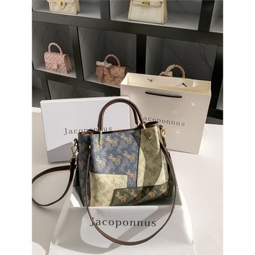 雅各邦真皮補丁拼色水桶包女2025新款包包輕奢高級感小眾手提斜挎