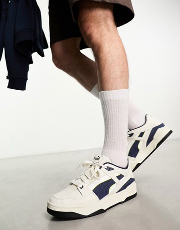 Puma Slipstream trainers in off white and navy