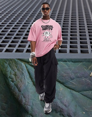 ASOS DESIGN oversized t-shirt in pink with cartoon front print