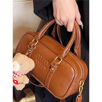 法國MK保齡球包包女2024新款高級感復古枕頭包真皮手提單肩斜挎包