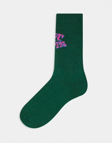 ASOS DESIGN shit happens slogan socks in green