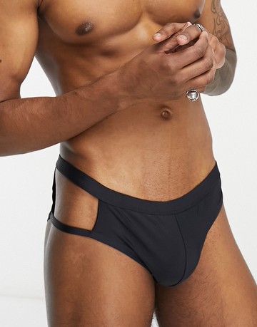 ASOS DESIGN swim trunks with cut out in black