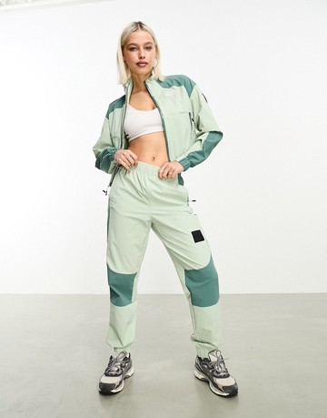 The North Face NSE woven shell joggers in sage green