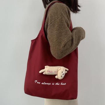 可愛公仔小眾帆布包女單肩日系文藝百搭字母大容量學生上課拉鏈袋