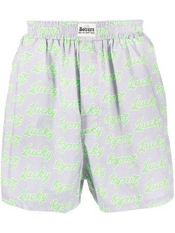 Natasha Zinko - all-over slogan-print cotton shorts - unisex - Cotton - XS - Grey