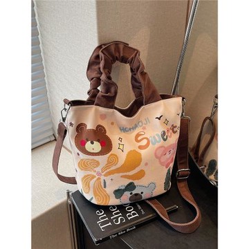 原創小眾設計插畫水桶帆布包女2025新款可愛手提通勤包休閑斜挎包